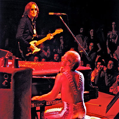 Elton John on stage with John Lennon