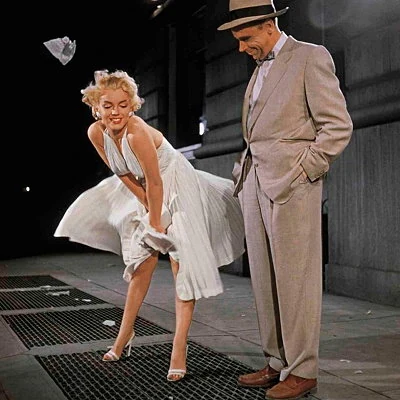 Marilyn Monroe and Tom Ewell star in the 1955 romantic comedy film The Seven Year Itch directed by Billy Wilder.