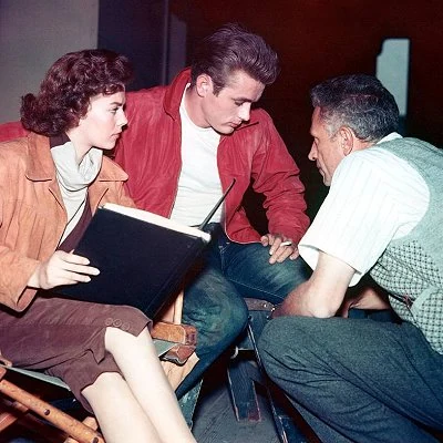 Director Nicolas Ray working with actors James Dean and Natalie Wood during the filming of the teen drama Rebel Without A Cause.