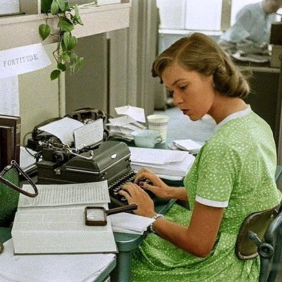 Office scene showing a secretary hard at work in New York City.