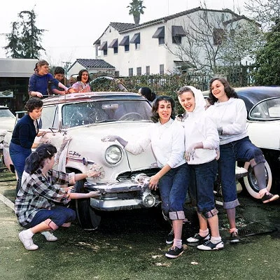 High school girls having fun with a car wash in Los Angeles.