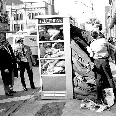 Seeing how many people can fit into a phone booth was a popular gag for young people in 1959.