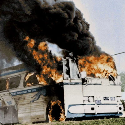 "Freedom Riders" test the United States Supreme Court decision Boynton v. Virginia by riding racially integrated interstate buses into the South. In Anniston, Alabama their bus is set on fire with the freedom riders inside, many are badly beaten by local KKK members as they flee the bus.