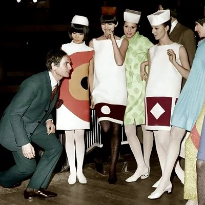 Italian fashion designer Pierre Cardin preparing models for a 1964 fashion show.
