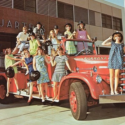 1968 American high school group posing on a fire truck.