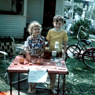 Real photo of children operating a lemonade stand in 1969.