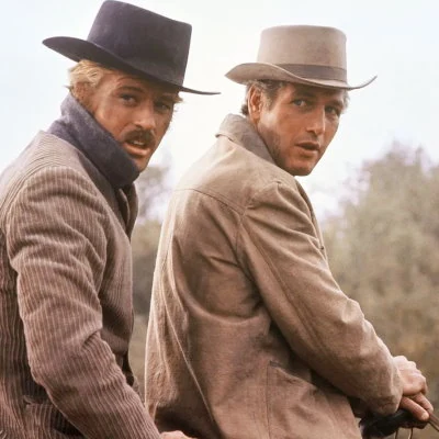 Hollywood heart-throbs Paul Newman and Robert Redford play outlaws in the popular film Butch Cassidy and The Sundance Kid.