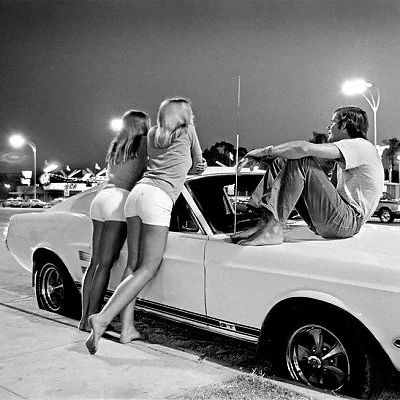 Hanging out or driving up and down a particular strip of roadway was a popular pastime in the 70's. Photographer Rick McCloskey captures the "cruising" scene along California's Van Nuys Boulevard in 1972.