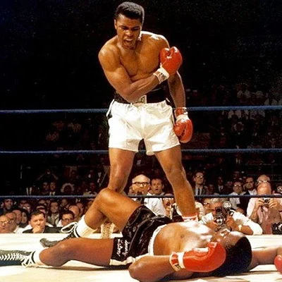 Former heavyweight boxing champion Muhammed Ali fights current champ George Foreman in Kinshasa, Zaire, Africa in a bout called The Rumble In The Jungle. Ali knocks Foreman out in the eighth round for an upset victory.
