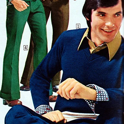 Detail from a 1974 Sears Catalog showing men with large pointed collars and cuffed, flared pants.