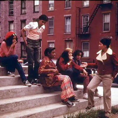 Brooklyn, New York City teens hanging out on stairs.