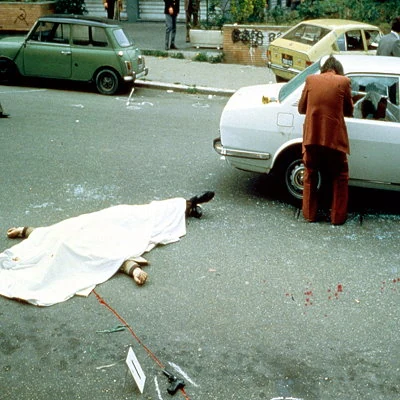 In Italy the far left terrorist organization Brigate Rosse kidnap former Premiere Aldo Moro in an attack that leaves five bodyguards dead. After realizing the government was unwilling to negotiate for Moro's release, he was shot and killed 54 days later.