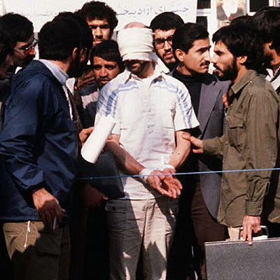 A group of militant Iranian college students take over the U.S. Embassy in Tehran and hold 52 Americans hostage, following the Iranian revolution and the ouster of the Shah of Iran. The hostages are held for the next 444 days and released in January 1981.