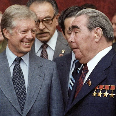 President Jimmy Carter of the US and USSR leader Leonid Brezhnev reach agreement in the SALT ll (Strategic Arms Limitation Talks) to limit expansion of nuclear missiles.