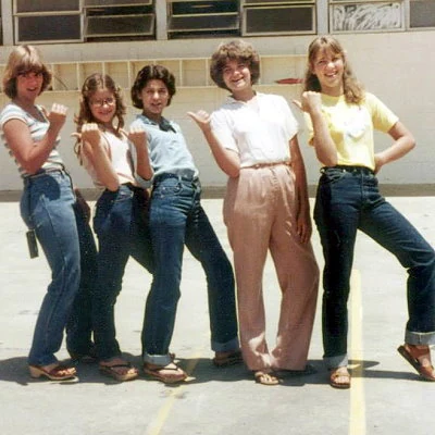Middle school girls posing for a photograph.