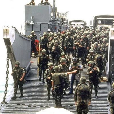 Fearing another Cuba, the U.S. and a coalition of six other Caribbean nations invade Grenada and depose the People's Revolutionary Government which had seized power just weeks earlier. US troops met with little resistance and occupied the country until Democratic elections were held in 1984.