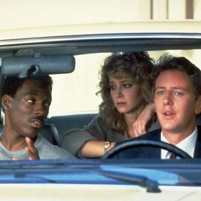 The top box office hit of 1984 is the action comedy Beverly Hills Cop starring Eddie Murphy as Axel Foley, a street smart Detroit cop visiting Beverly Hills to solve a murder.