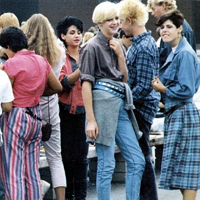 Teenagers gather outside the high school in Saugus, California.