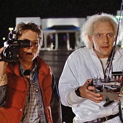 Back To The Future is the number one box office hit of 1985. Directed by Robert Zemeckis and starring Michael J. Fox, the science fiction film spawns two sequels and a multimedia franchise.
