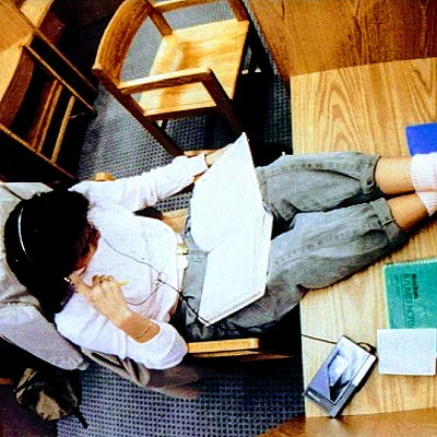 American college student studying in the library.
