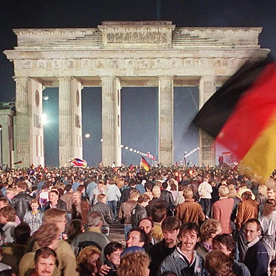 After the collapse of communism and the fall of the Berlin Wall the previous year, East and West Germany agree to unification as a single government with Berlin as the capital.