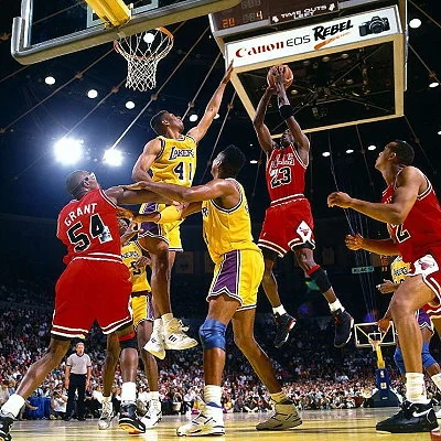 The Chicago Bulls, lead by Michael Jordan, win their first NBA Championship, defeating the Los Angeles Lakers.