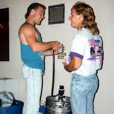 Two guys chatting at a keg party 1992.