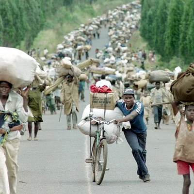 Over 500,000 ethnic minority Tutsi's are killed in the Rwandan Genocide by members of the Hutu majority during the Rwandan Civil War. The war and genocide, spark a large scale refugee crisis as Tutsi's attempt to flee to safety.