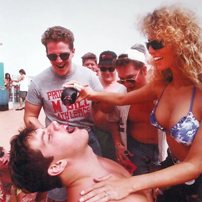 Pouring a shot during Spring Break in Galveston, Texas.