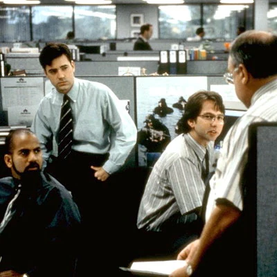 The black comedy satire Office Space starring Ron Livingston, Jennifer Aniston, Stephen Root, Gary Cole, David Herman, and Ajay Naidu is a box office failure. Written and directed by Mike Judge (Beavis & Butthead) the film is aired often on Comedy Central and eventually becomes a cult favorite in home video.