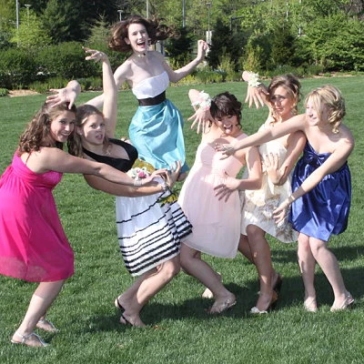 Action pose from six high school girls before prom.